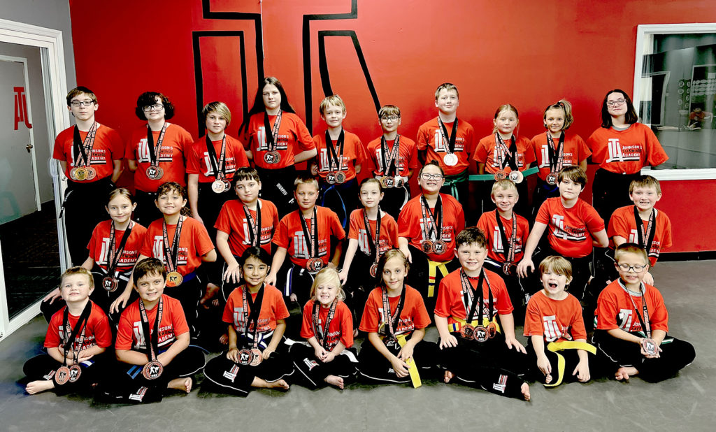 Competitors from Johnson's TaeKwonDo Academy in Dayton pose for pic with medals won at recent tournament in Chattanooga on Noveember 6, 2021.(Photo:Submitted)